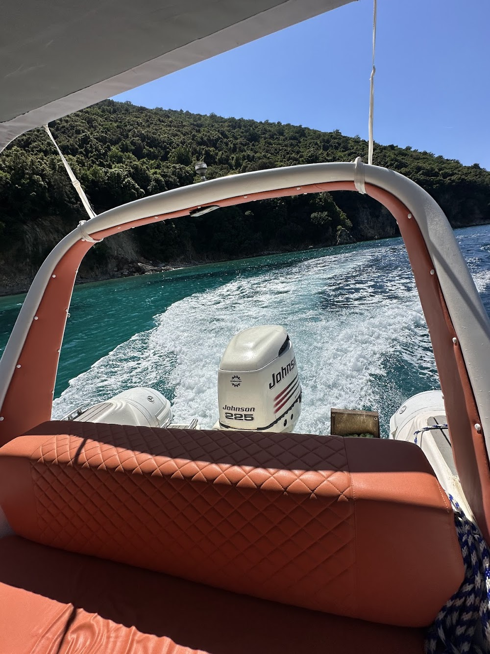DES boat waiting in a Sarandë cove